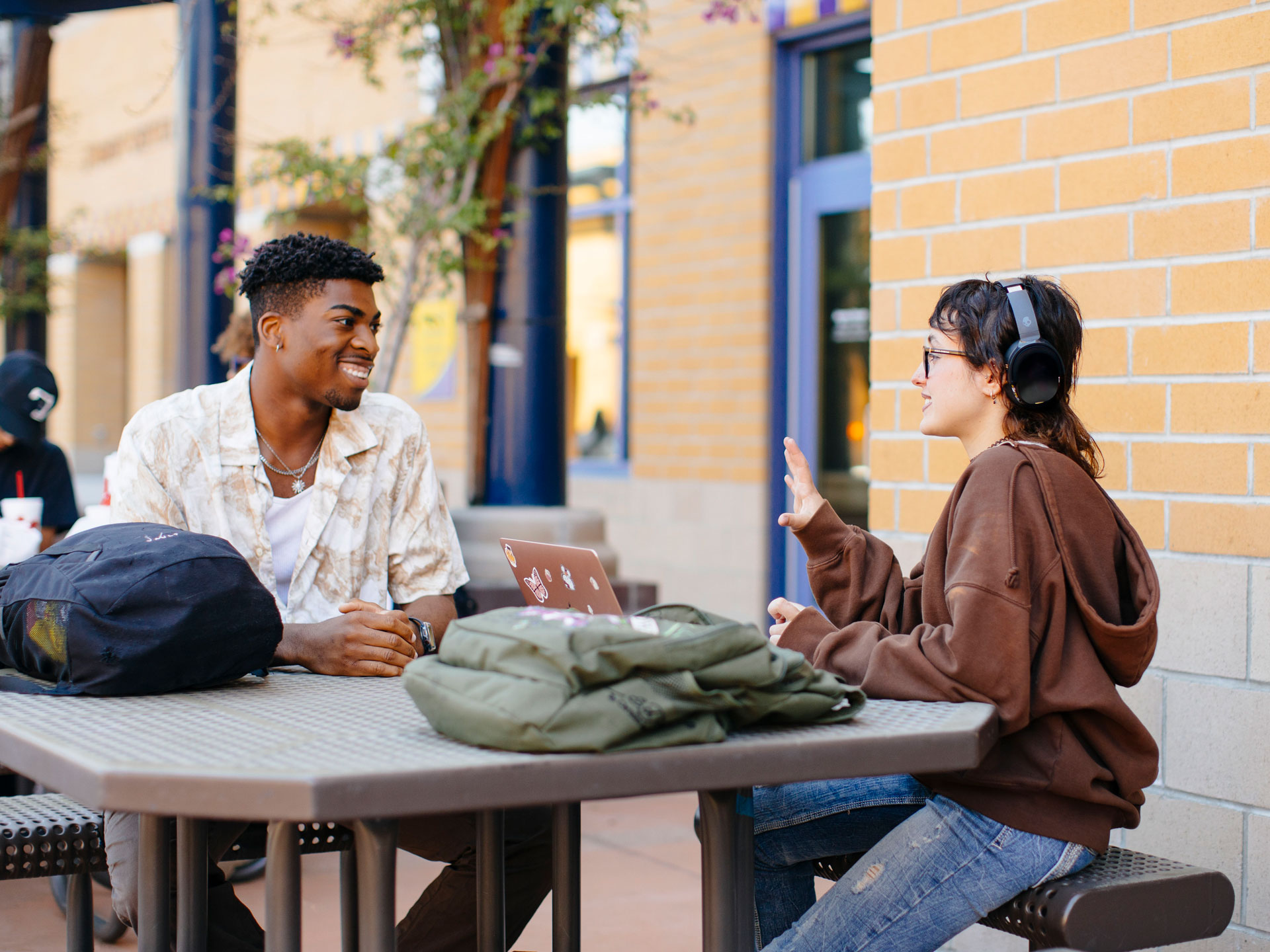 UC Irvine students talking in front of the Student Center