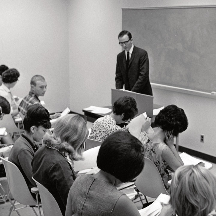 Black and white photo of instructor in classroom on first day of classes at UC Irvine in 1965