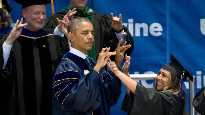 President Barack Obama learns how to Zot at commencement in 2014.