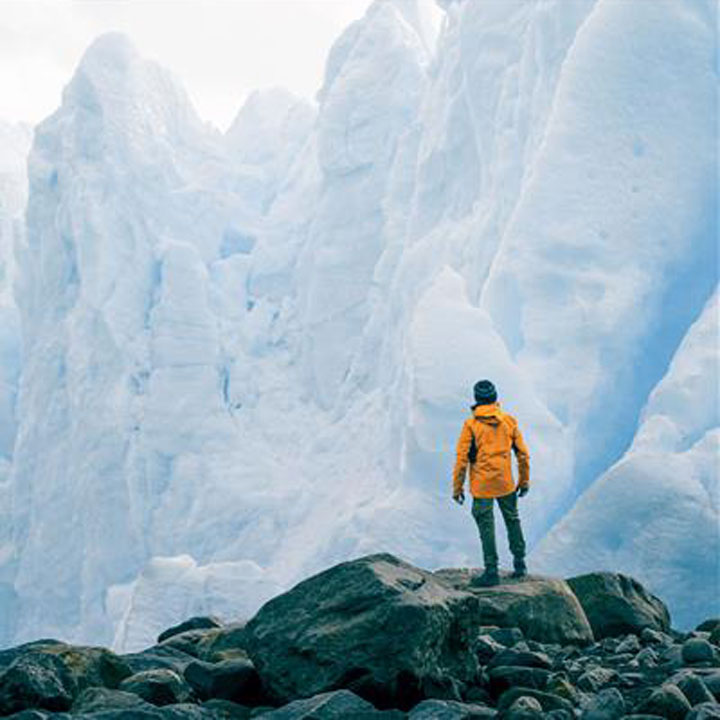 man in front of melting glaciers