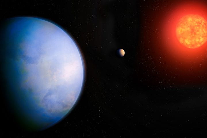 An artist’s conception of GJ 251 c, showing the planet (left), its host star (right), and a previously discovered planet that orbits closer to the star (middle). Michael Marcheschi / m2design