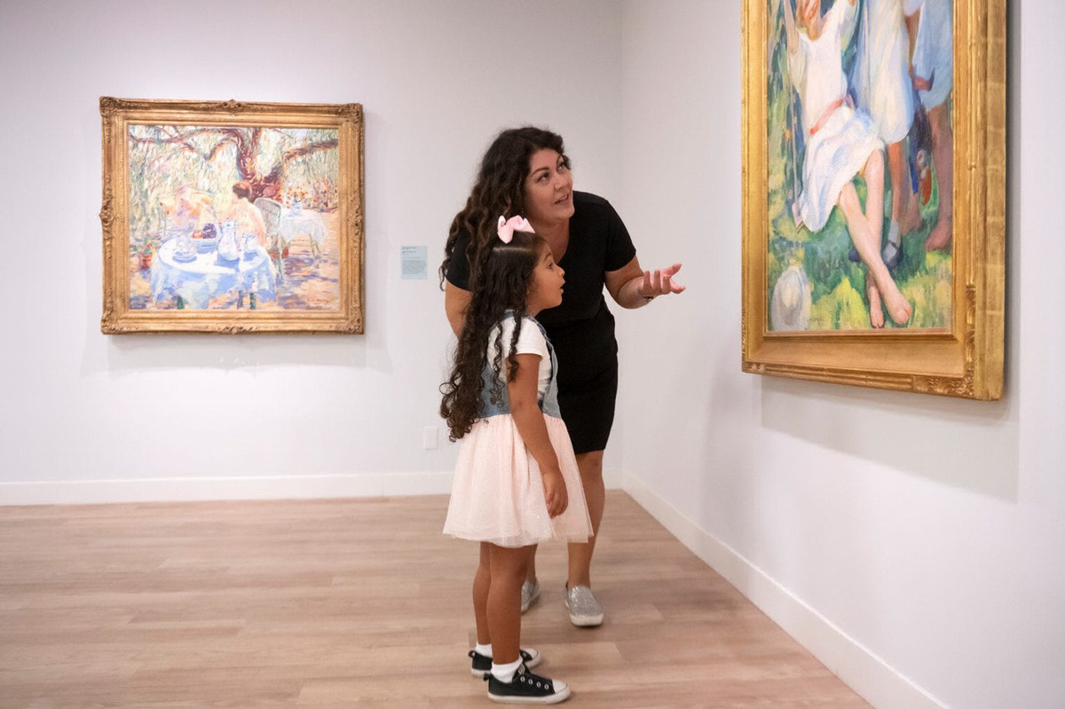 A mother and daughter enjoy the 2024 “Picturing Summer” exhibition